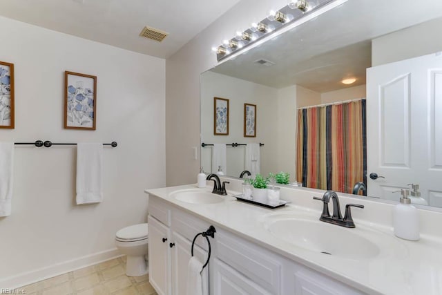 3914 Van Ness Dr, Virginia Beach, VA 23462 - bathroom featuring double vanity, toilet, baseboards, and curtained shower