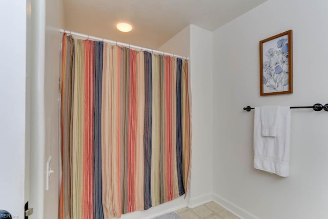 3914 Van Ness Dr, Virginia Beach, VA 23462 - bathroom featuring baseboards and a shower with curtain