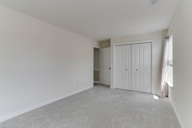 3914 Van Ness Dr, Virginia Beach, VA 23462 - unfurnished bedroom with light colored carpet, baseboards, and a closet