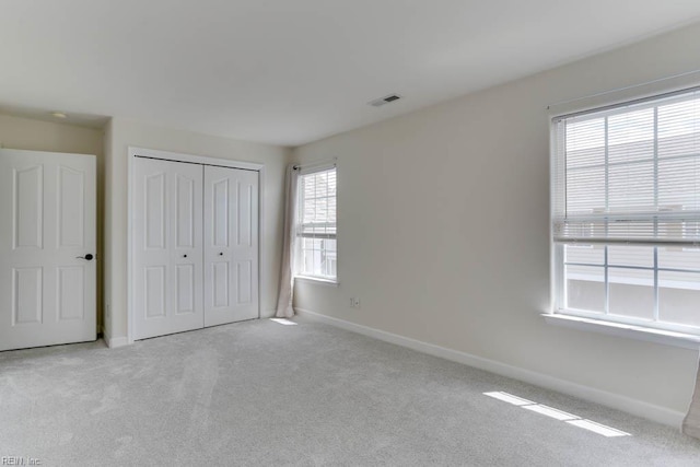 3914 Van Ness Dr, Virginia Beach, VA 23462 - unfurnished bedroom featuring baseboards, carpet, and a closet