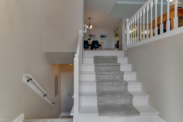 3914 Van Ness Dr, Virginia Beach, VA 23462 - stairs with a chandelier