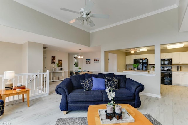 3914 Van Ness Dr, Virginia Beach, VA 23462 - living room featuring light wood finished floors, ceiling fan, crown molding, a chandelier, and a high ceiling