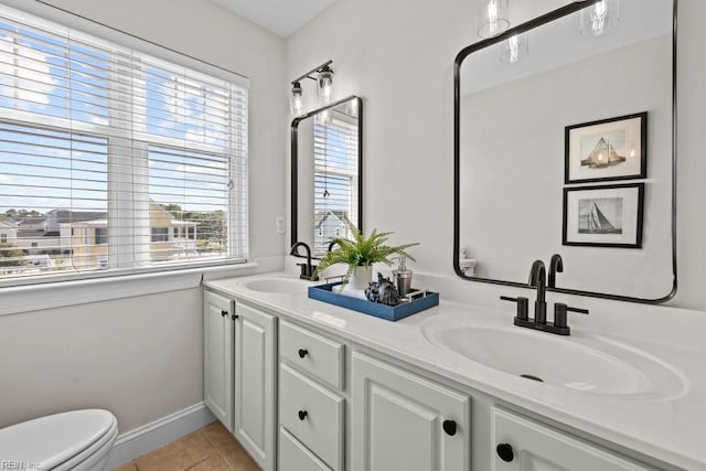 2512 E Ocean View Ave Unit A, Norfolk, VA 23518 - bathroom with plenty of natural light, toilet, tile patterned flooring, and double vanity