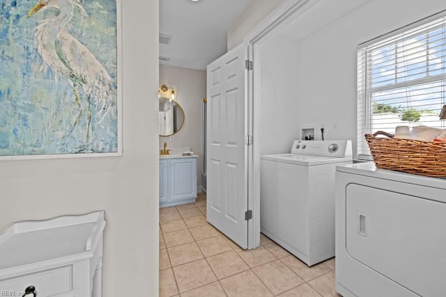2512 E Ocean View Ave Unit A, Norfolk, VA 23518 - washroom featuring separate washer and dryer and light tile patterned flooring