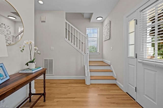 2512 E Ocean View Ave Unit A, Norfolk, VA 23518 - foyer entrance featuring plenty of natural light, stairway, light wood finished floors, baseboards, and recessed lighting