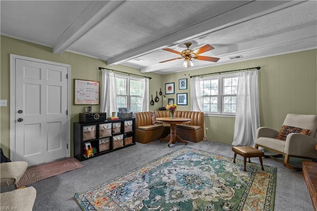 6110 Lyndhurst Ave, Norfolk, VA 23502 - living area featuring carpet, healthy amount of natural light, beamed ceiling, ceiling fan, and a textured ceiling