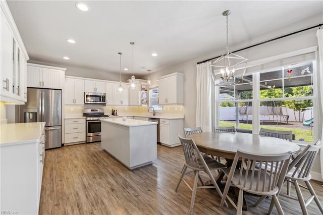 1328 Andreas Ln, Chesapeake, VA 23322 - kitchen featuring stainless steel appliances, a chandelier, a center island, recessed lighting, and light wood-style flooring