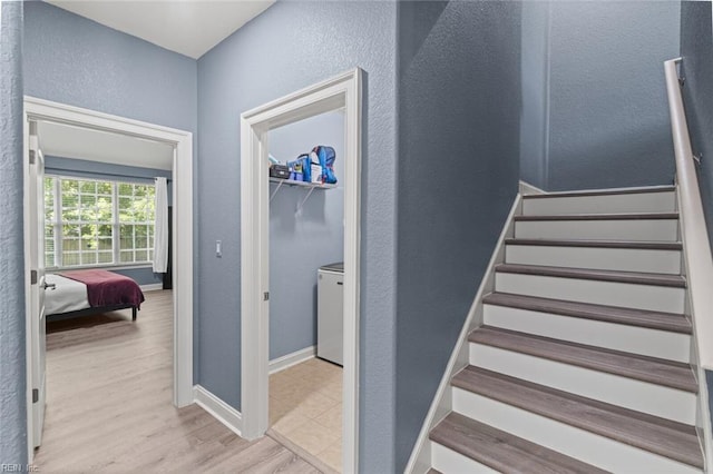 6309 Orchard Cove Ct, Suffolk, VA 23435 - staircase with a textured wall, wood finished floors, and baseboards
