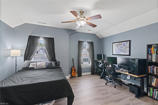 6309 Orchard Cove Ct, Suffolk, VA 23435 - bedroom with lofted ceiling, wood finished floors, multiple windows, a desk, and ceiling fan