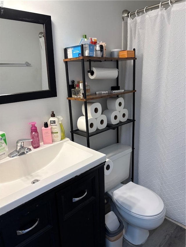 3684 Windmill Dr, Virginia Beach, VA 23453 - bathroom with vanity, toilet, wood finished floors, and a shower with shower curtain