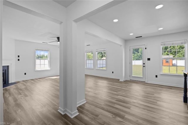 130 Rochdale Ln, Suffolk, VA 23434 - unfurnished living room featuring a ceiling fan, wood finished floors, baseboards, a fireplace with flush hearth, and recessed lighting