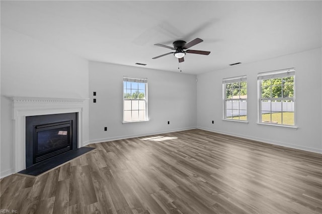 130 Rochdale Ln, Suffolk, VA 23434 - unfurnished living room with ceiling fan, wood finished floors, baseboards, and a glass covered fireplace