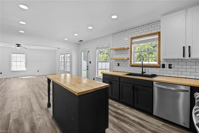 130 Rochdale Ln, Suffolk, VA 23434 - kitchen with butcher block countertops, dishwasher, a sink, plenty of natural light, and recessed lighting