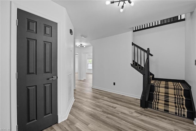 130 Rochdale Ln, Suffolk, VA 23434 - hall with wood finished floors, baseboards, and stairs