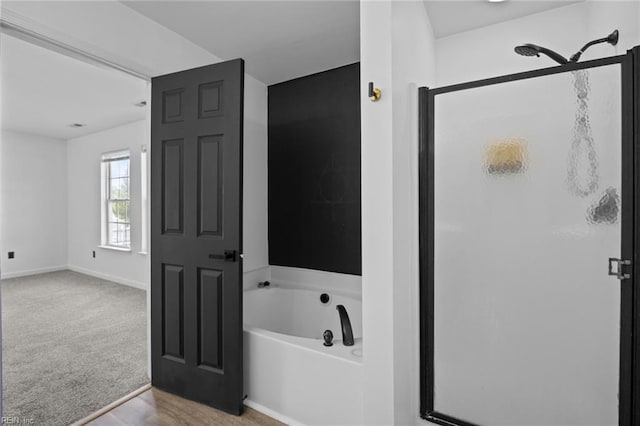 130 Rochdale Ln, Suffolk, VA 23434 - bathroom with a bath, a shower stall, and baseboards