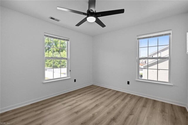 130 Rochdale Ln, Suffolk, VA 23434 - spare room featuring light wood-style floors, baseboards, and a ceiling fan