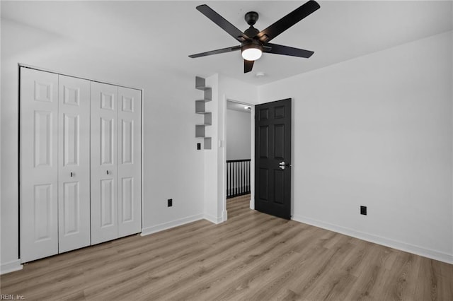 130 Rochdale Ln, Suffolk, VA 23434 - unfurnished bedroom featuring light wood-style flooring, baseboards, a closet, and ceiling fan