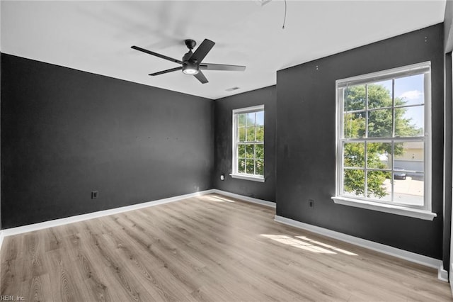 130 Rochdale Ln, Suffolk, VA 23434 - spare room with healthy amount of natural light, light wood-style flooring, and ceiling fan