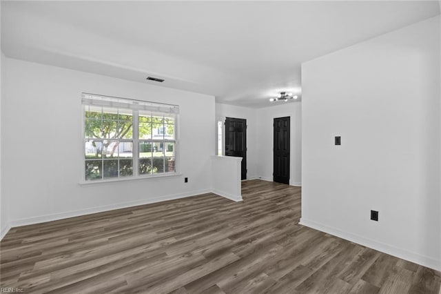 130 Rochdale Ln, Suffolk, VA 23434 - empty room featuring dark wood-type flooring and baseboards