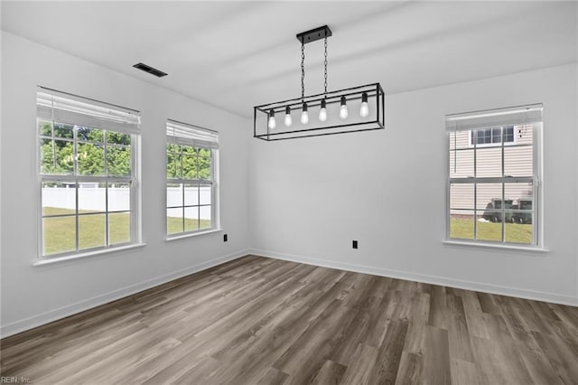 130 Rochdale Ln, Suffolk, VA 23434 - unfurnished dining area featuring dark wood-style flooring and baseboards
