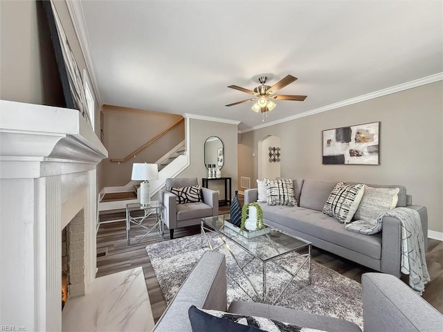 134 Chesterfield Rd, Hampton, VA 23661 - living area with a brick fireplace, baseboards, wood finished floors, crown molding, and stairway