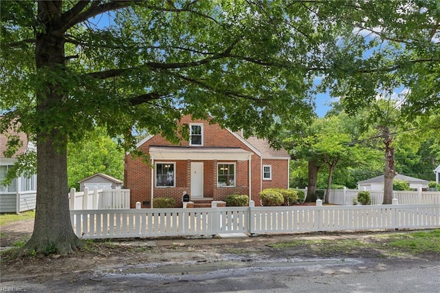 134 Chesterfield Rd, Hampton, VA 23661 - bungalow-style home with brick siding and a fenced front yard