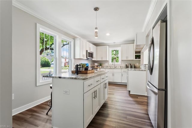 134 Chesterfield Rd, Hampton, VA 23661 - kitchen with appliances with stainless steel finishes, crown molding, plenty of natural light, white cabinets, and a sink