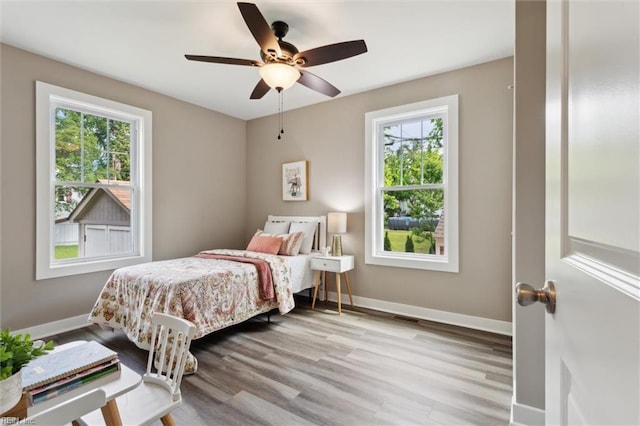 134 Chesterfield Rd, Hampton, VA 23661 - bedroom featuring multiple windows, wood finished floors, baseboards, and a ceiling fan