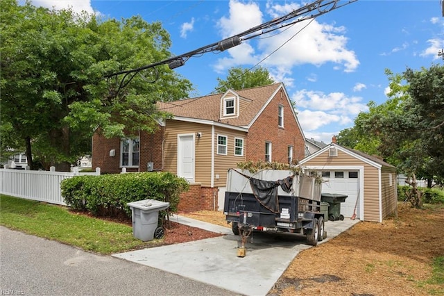 134 Chesterfield Rd, Hampton, VA 23661 - view of property exterior with driveway, an outdoor structure, brick siding, and a garage