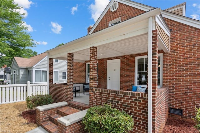 134 Chesterfield Rd, Hampton, VA 23661 - view of front of house with covered porch, brick siding, and crawl space