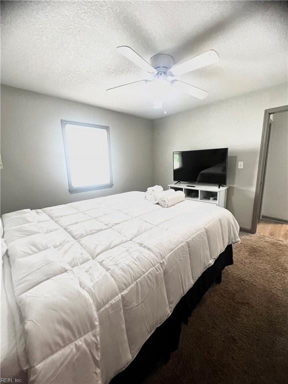 1628 Bourbon Ave, Norfolk, VA 23509 - bedroom featuring a textured ceiling, light colored carpet, and a ceiling fan