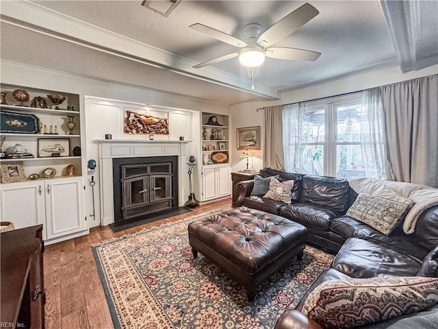 1907 Eastborne Dr, Virginia Beach, VA 23454 - living room featuring a ceiling fan, ornamental molding, built in shelves, wood finished floors, and a fireplace with flush hearth