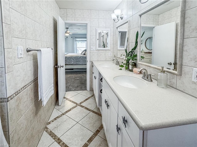 1907 Eastborne Dr, Virginia Beach, VA 23454 - bathroom featuring tile walls, ensuite bath, double vanity, tile patterned flooring, and inlaid floor details