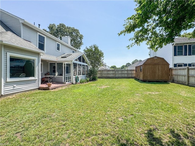 1907 Eastborne Dr, Virginia Beach, VA 23454 - view of yard with a storage unit, a deck, an outbuilding, and a sunroom