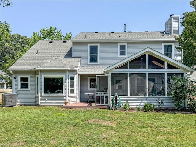1907 Eastborne Dr, Virginia Beach, VA 23454 - back of property with a sunroom, a wooden deck, a chimney, a yard, and central AC unit