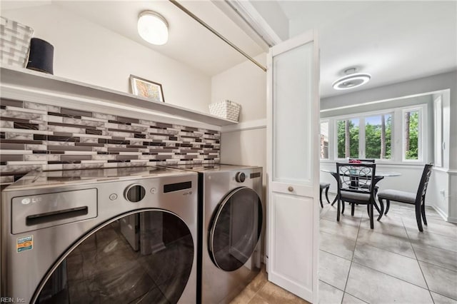 108 Bayview Dr, Yorktown, VA 23692 - washroom featuring washing machine and clothes dryer and light tile patterned flooring