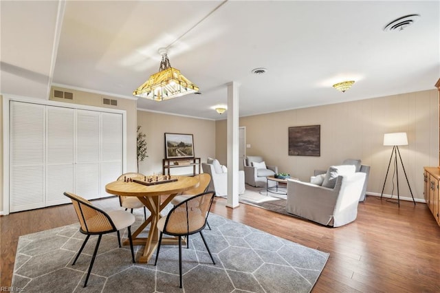 108 Bayview Dr, Yorktown, VA 23692 - dining area featuring wood finished floors and crown molding