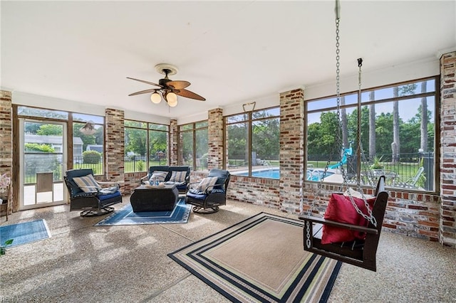 108 Bayview Dr, Yorktown, VA 23692 - sunroom / solarium featuring brick wall and speckle patterned floor