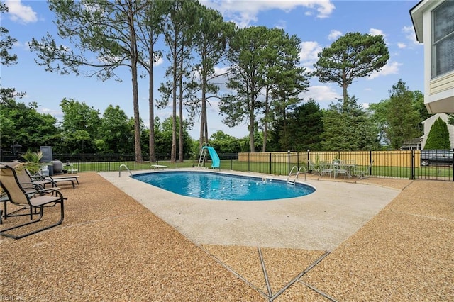 108 Bayview Dr, Yorktown, VA 23692 - view of pool with a patio area, a water slide, and view of scattered trees