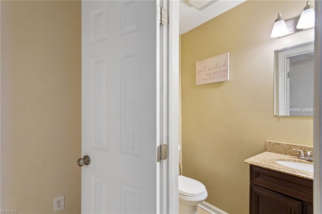 2212 Wildwood Rd, Chesapeake, VA 23323 - bathroom featuring toilet, vanity, and baseboards