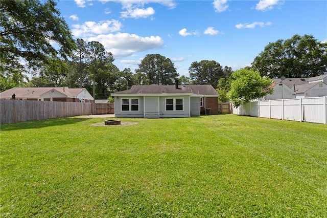 2212 Wildwood Rd, Chesapeake, VA 23323 - rear view of house featuring an outdoor fire pit and cooling unit
