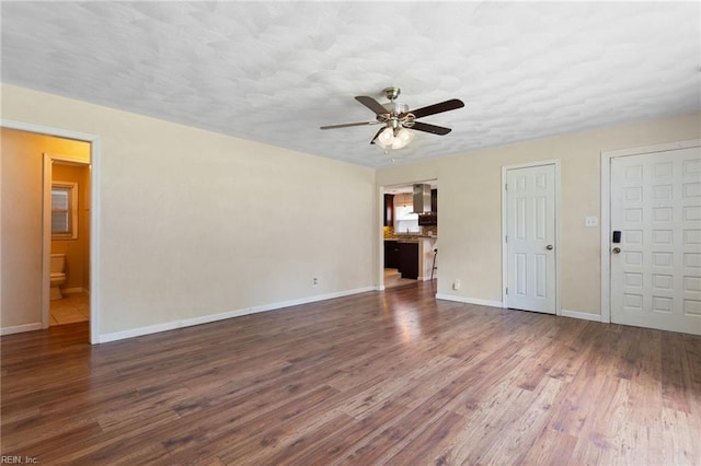 2212 Wildwood Rd, Chesapeake, VA 23323 - unfurnished living room with ceiling fan, wood finished floors, and baseboards