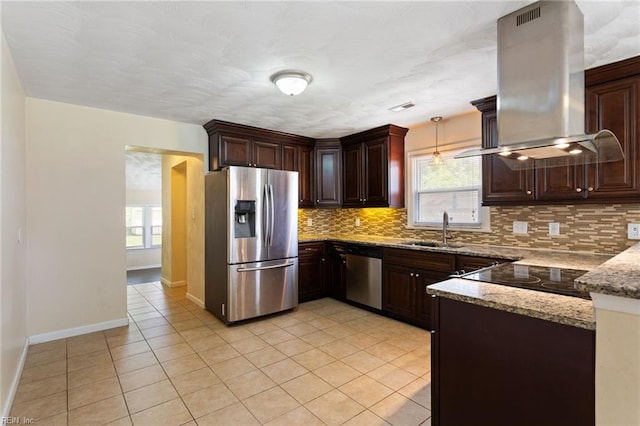 2212 Wildwood Rd, Chesapeake, VA 23323 - kitchen featuring appliances with stainless steel finishes, a sink, island range hood, and plenty of natural light