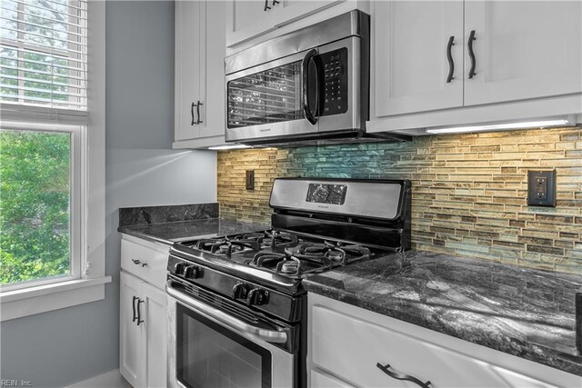 9514 25th Bay St, Norfolk, VA 23518 - kitchen featuring stainless steel appliances, white cabinetry, backsplash, and dark stone countertops