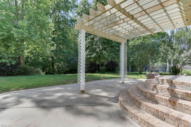 view of patio with a pergola and view of scattered trees