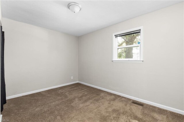 910 Truman Rd, Suffolk, VA 23434 - carpeted spare room with baseboards
