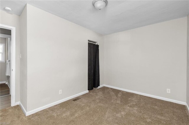910 Truman Rd, Suffolk, VA 23434 - carpeted spare room featuring baseboards and a smoke detector