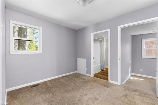 910 Truman Rd, Suffolk, VA 23434 - unfurnished bedroom featuring carpet flooring and baseboards