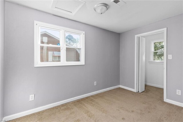 910 Truman Rd, Suffolk, VA 23434 - unfurnished bedroom with carpet flooring, attic access, and baseboards