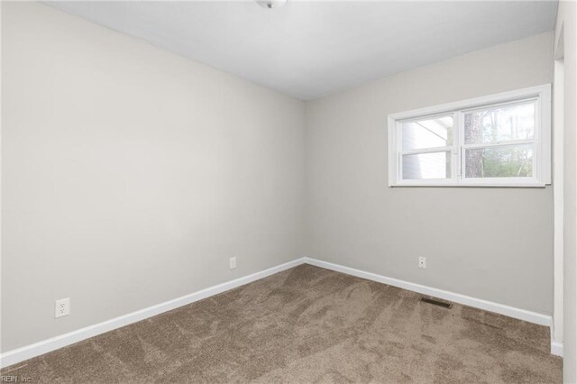 910 Truman Rd, Suffolk, VA 23434 - carpeted empty room with baseboards